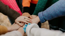 Hands stacked in a circle